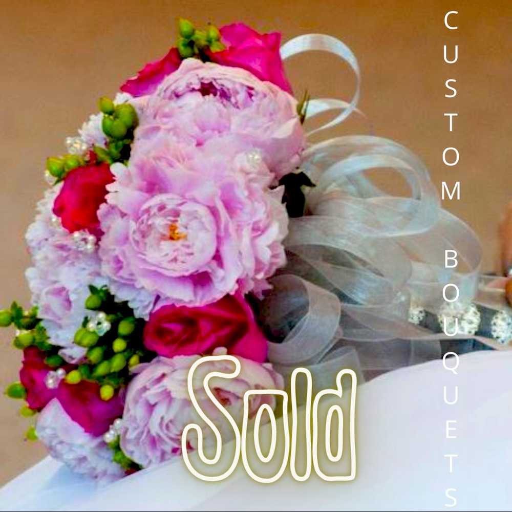Custom peony, roses, and hypericum berry wedding flowers.